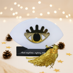 Γούρι μάτι βλεφαρίδες μαύρο με βάση σε άσπρο plexiglass